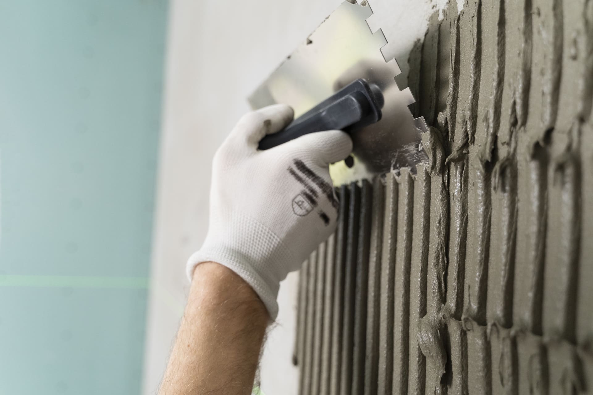 tiler-working-on-renovation-of-apartment